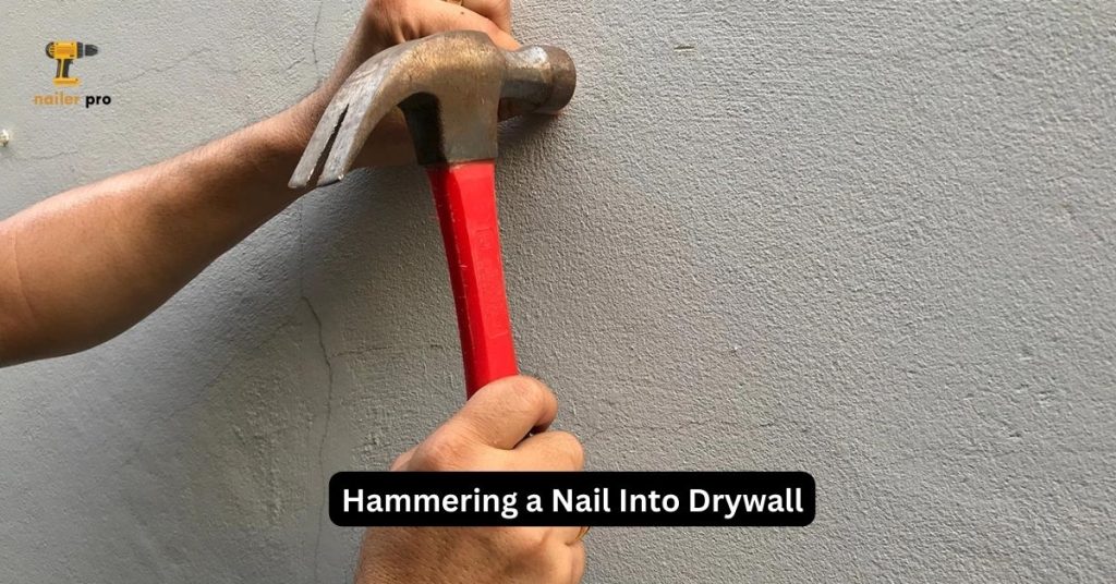 Hammering a Nail Into Drywall